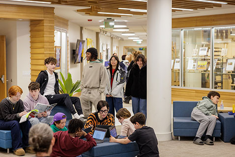 Students gathering in the hallway. Links to Gifts from Retirement Plans