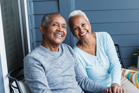 An older couple smiling. Links to Gifts of Life Insurance